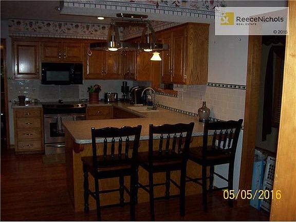 Kitchen from Laundry Room. Wood Floors