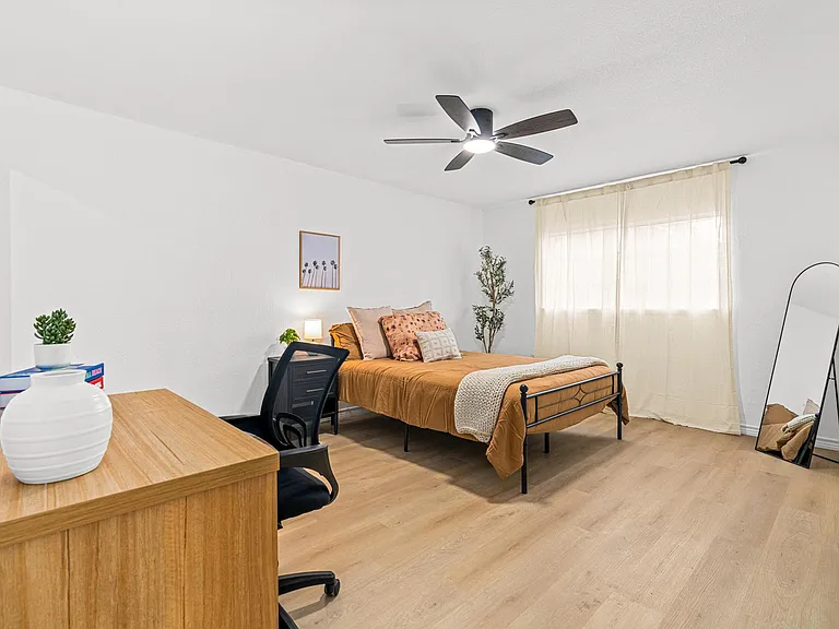 Large spacious room with workspace, nightstand, closet and mirror