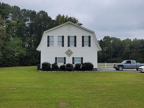 Front side features a custom barn quilt by Talara in West Jefferson, NC