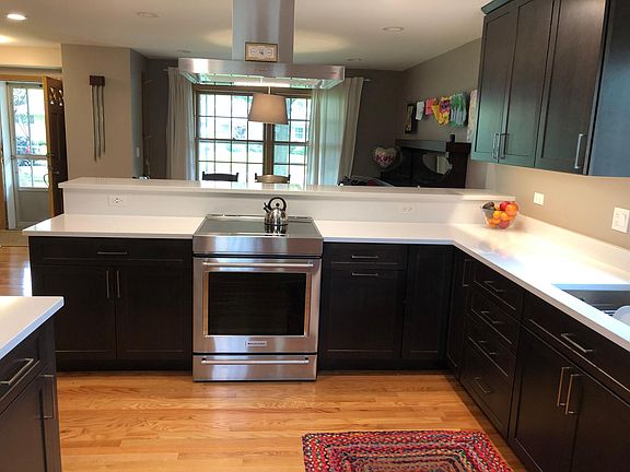 Seating on the other side of the island.