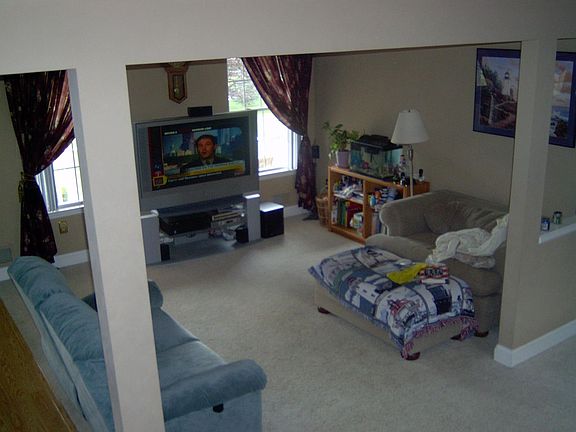 view of the living room from the stair landing