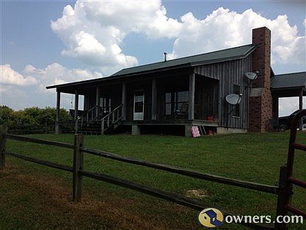 Side of the cabin and partial front view