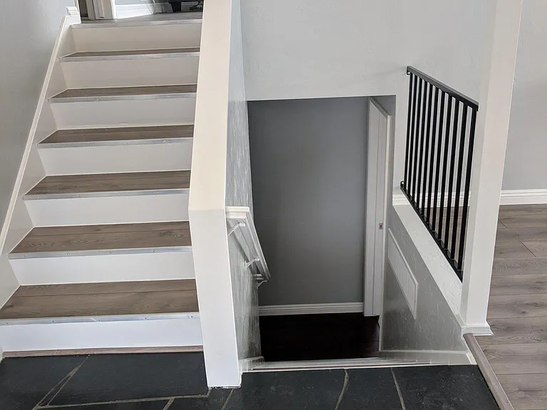 Entryway: upstairs to living room, balcony, bedroom #1 and bathroom.
Downstairs to two bedrooms, bathroom, and storage.