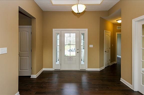 Welcoming foyer with trey ceiling