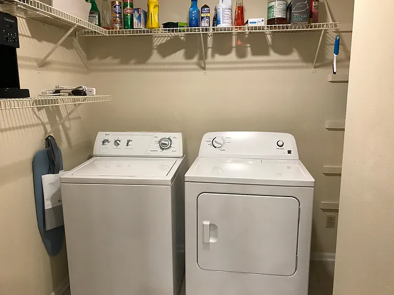 in unit washer and dryer, laundry room and pantry off of kitchen