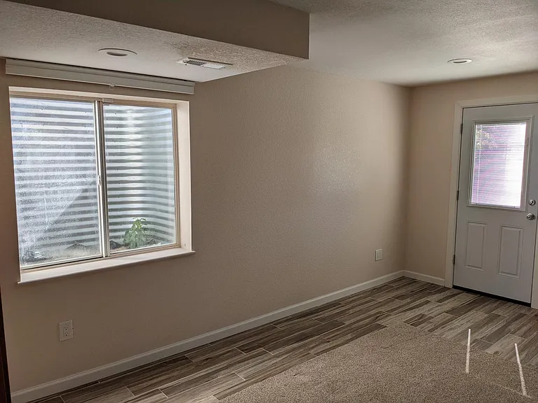 Living Area and Kitchen photo showing private entrance