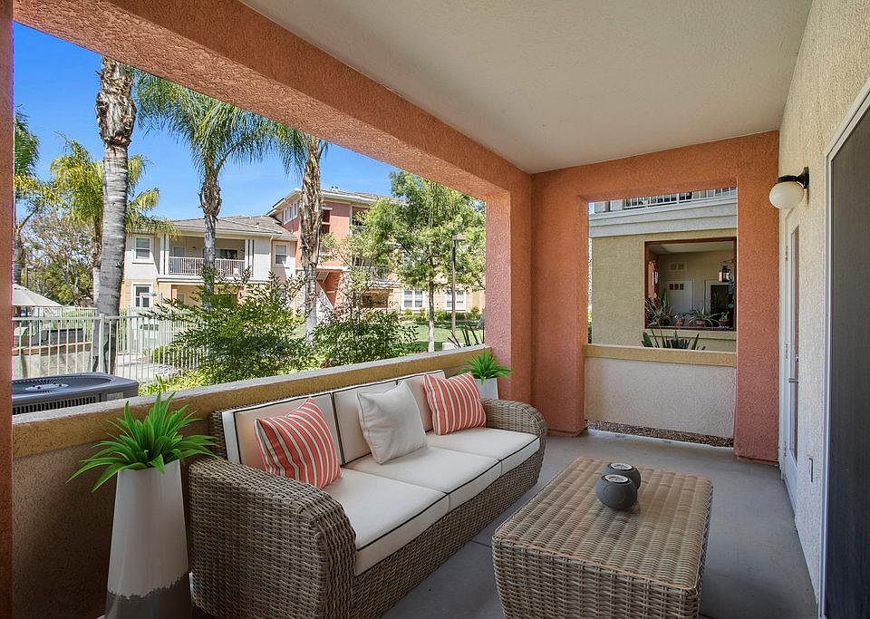 Patio, accessiable from both bedrooms and living room. View of pool/park from Patio