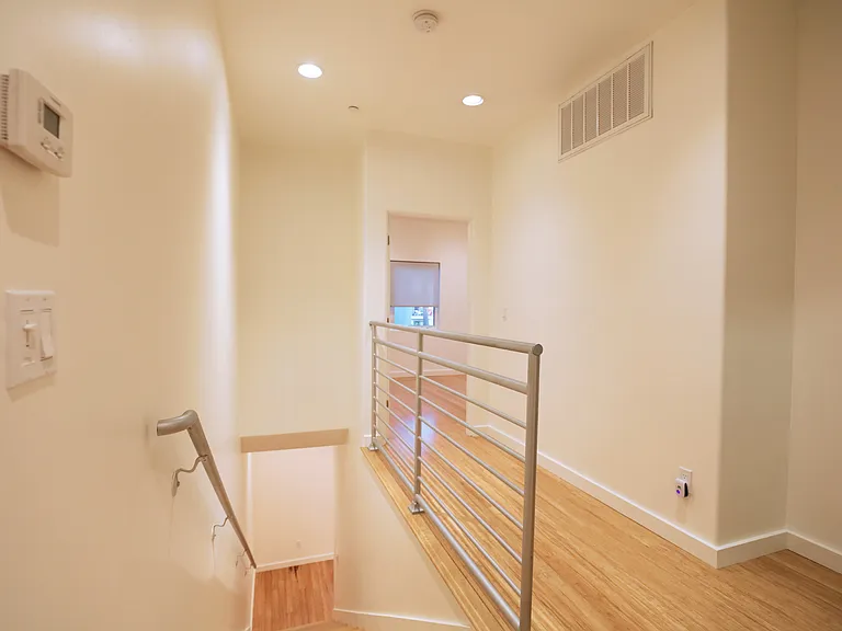 23. Third Floor Hallway Leading to Front Bedroom