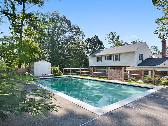 Back of home w/ pool