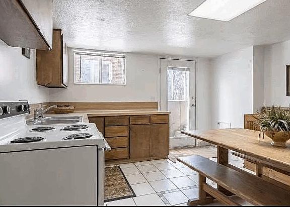 Front entrance into bright and roomy kitchen area.