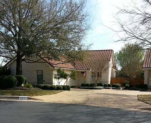 House at the end of the cul de sac. Picture from the street with wide shared driveway.