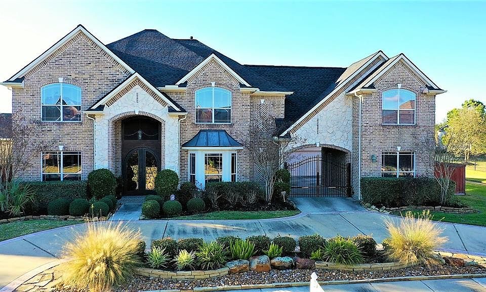 This impressive home sits on the highly desired and stately street of Prairie Clover... nestled on the edge of a quiet cul-de-sac, backing to serene views of the park-like walking paths that lead around the lake. Be sure to click the cinema icon abov