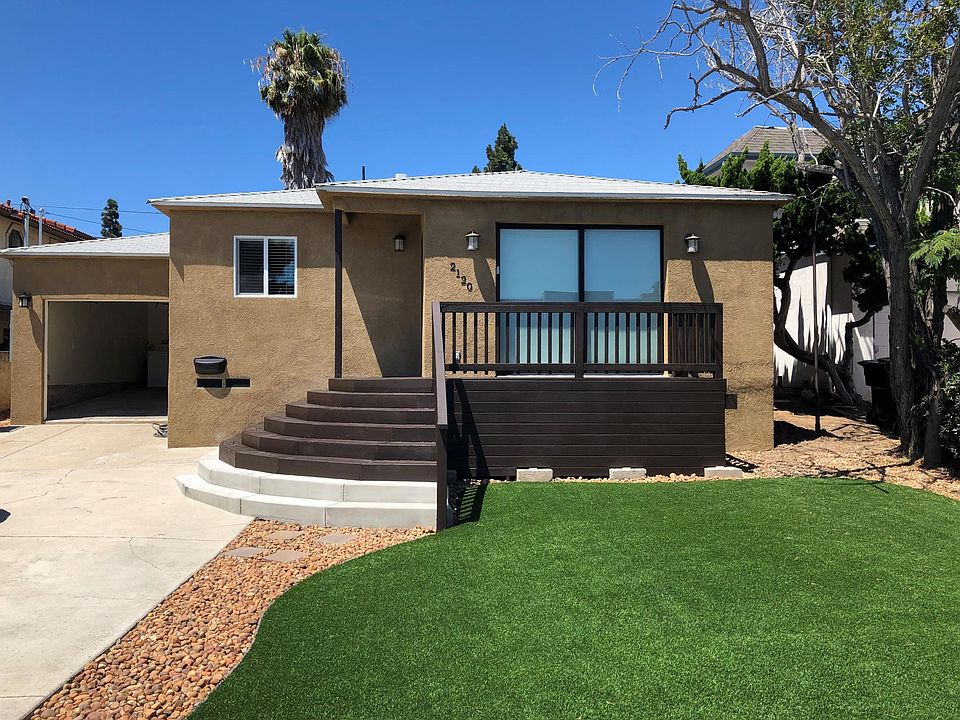 Front of house - showing deck. Patio doors recess completely allowing great air flow and access to deck.