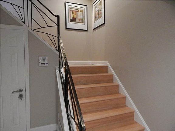 Hardwood stairs leading to the main living area.