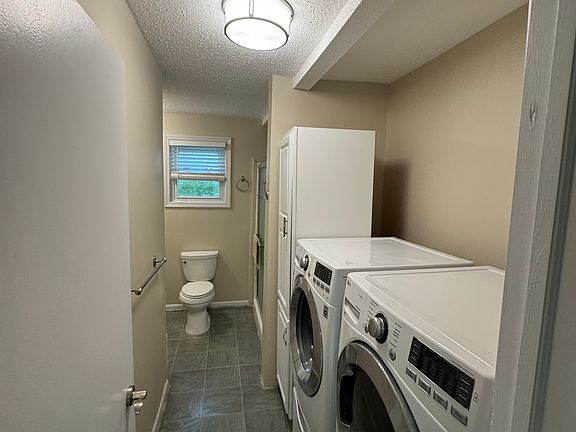 Bathroom with new washer and dryer