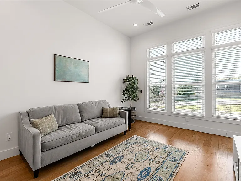 Third bedroom currently styled as a playroom but functions as a full bedroom with closet.