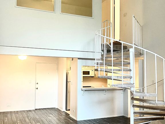 Currently throughout the downstairs new flooring & baseboards are being installed, removing carpet and updating spiral staircase.