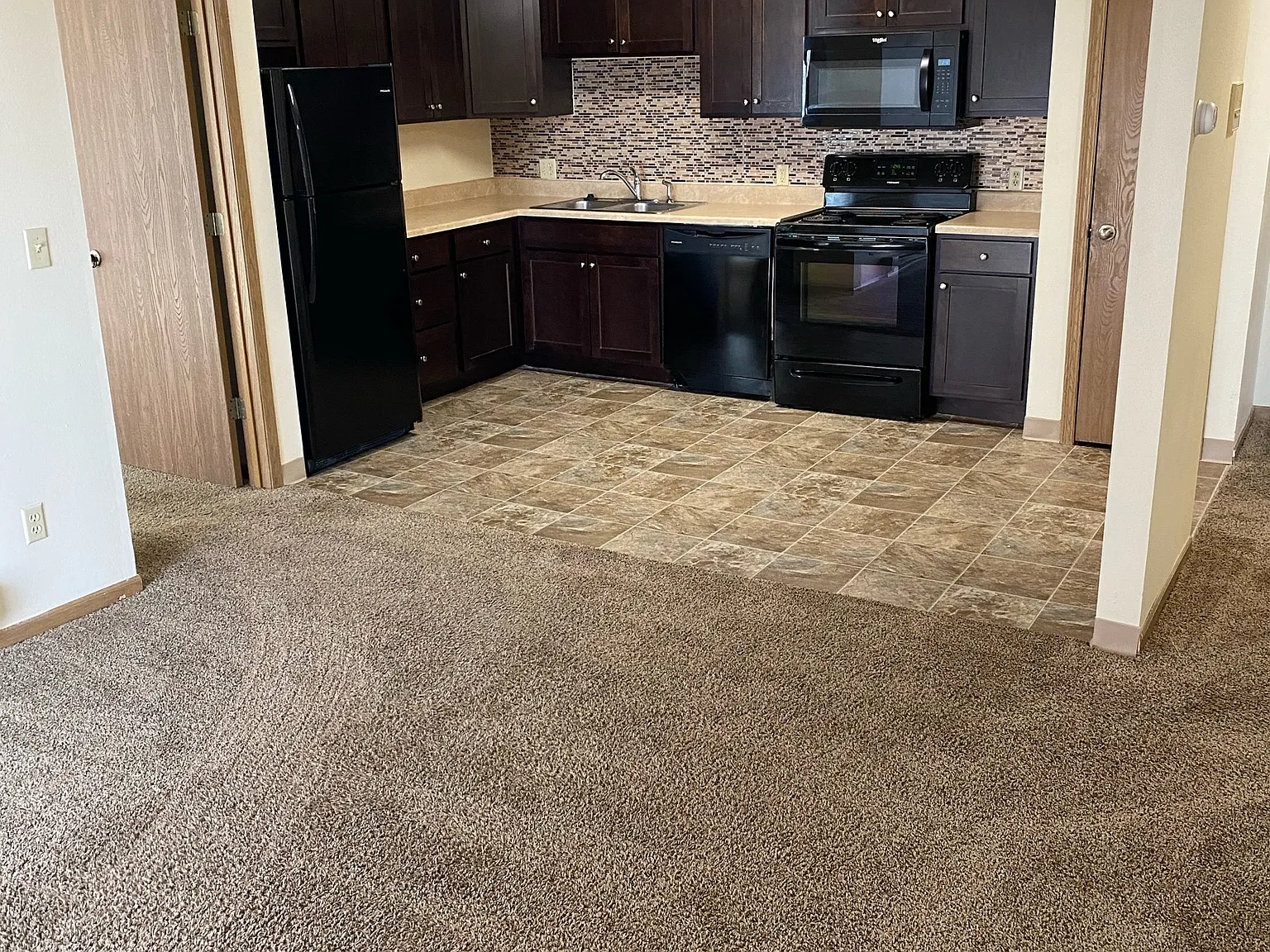 Meadow Wood Of Ames Apartment Building - 208 — Photo 2