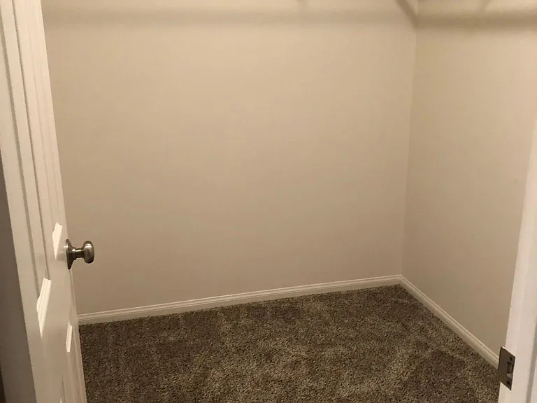Upstairs bedroom walk-in closet