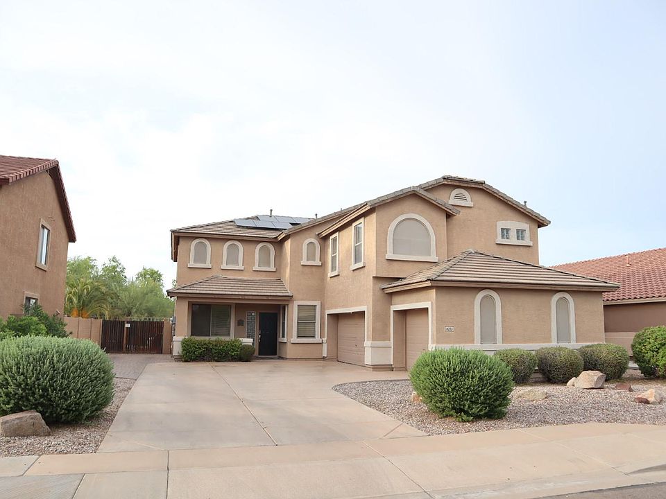 Curb Appeal. Gorgeous 2-Story with desert creek behind. 3-Car garage and HUGE driveway with additional paver parking at RV gate. Low maintenance desert landscape with irrigation drip system.