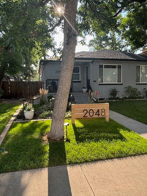 Charming home on a beautiful and quiet, tree lined street, just steps to Sloan's Lake.