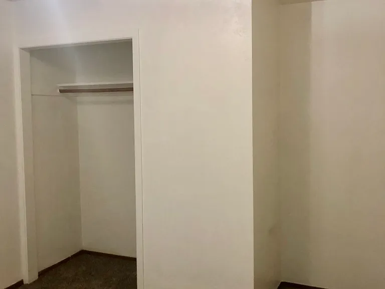 Bedroom closet and unique cut out for extra space!