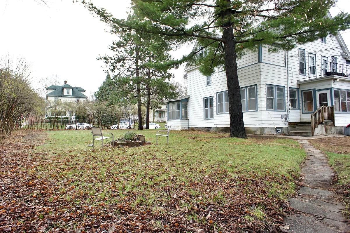 HUGE corner lot that is really private all summer long when the beautiful lilac hedge fills in green. - 2644 Taylor St NE #2644