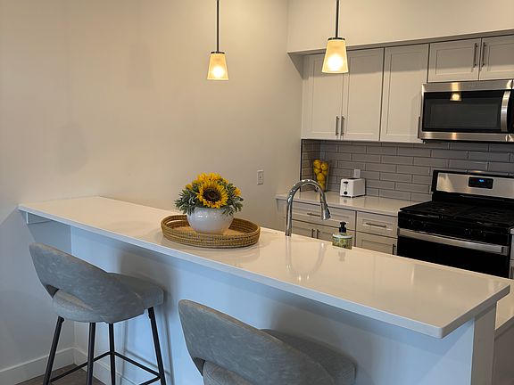 Eat in kitchen with stainless steel appliances