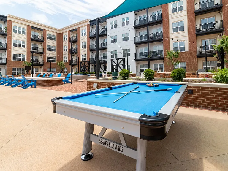 Hang out and get in a game at the pool table in the courtyard.