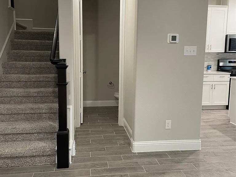 View of half bath and stairs