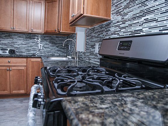New stainless appliances, countertop, tiles, cabinets and flooring
