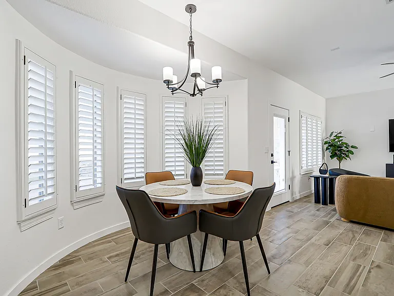 Dining area with 4 comfortable chairs.