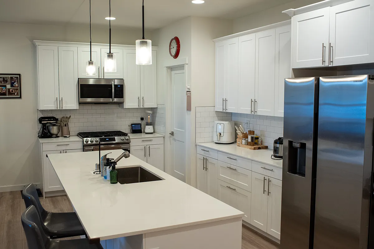 Kitchen. Note the quartz countertops and Stainless steel appliances.
Lot of counter pace and numerous cabinets. Lots of storage. - E Sullivan St
