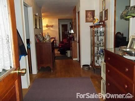 Hallway from Breezeway : Long view of house to kitchen and bedroom hallway.
