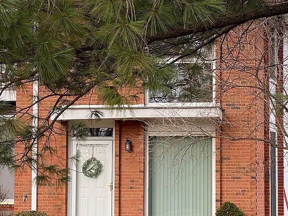 Private entrance facing green space.