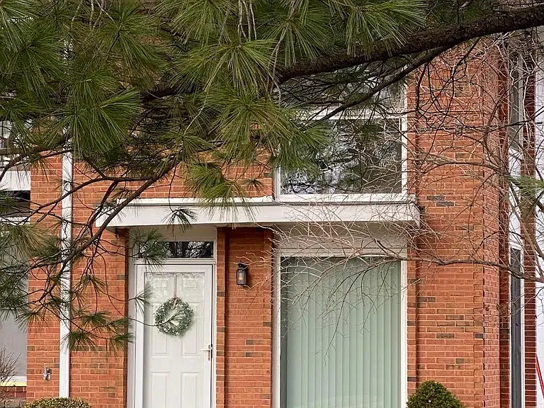 Private entrance facing green space.