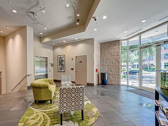 COZY LOBBY WITH DOORMAN DURING THE DAY