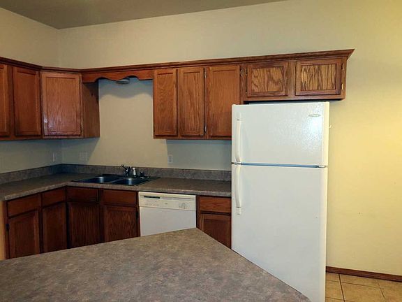 Kitchen with island

Photos are from the unit next door, but are representative of the space and decor.