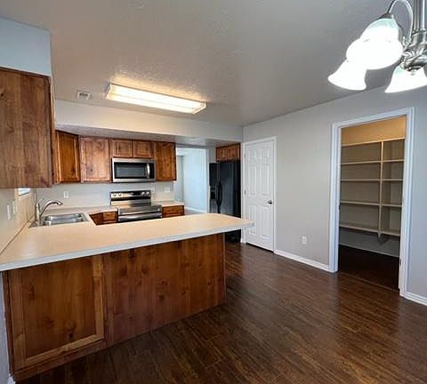 LVT flooring extends throughout main floor. Large pantry provides extra storage.