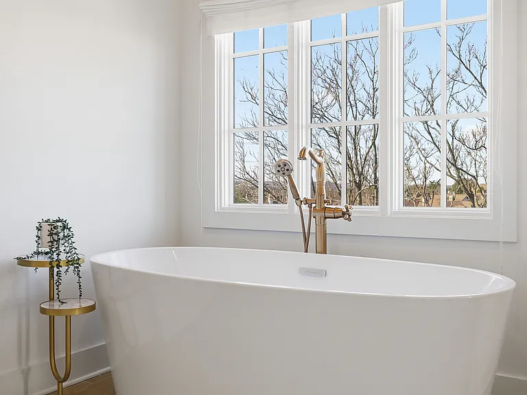 Full Bathroom connected to bedroom 1 with double vanity, shower, and large bathtub.