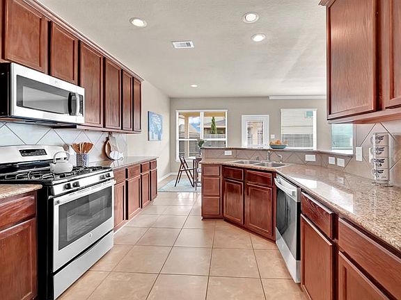 Large kitchen with an abundance of cabinets and counterspace. Plenty of room to whip up the favorite dish of your choice.