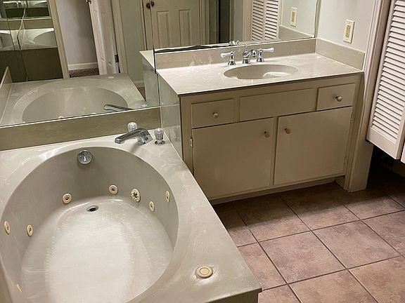 Bath includes garden tub and shower