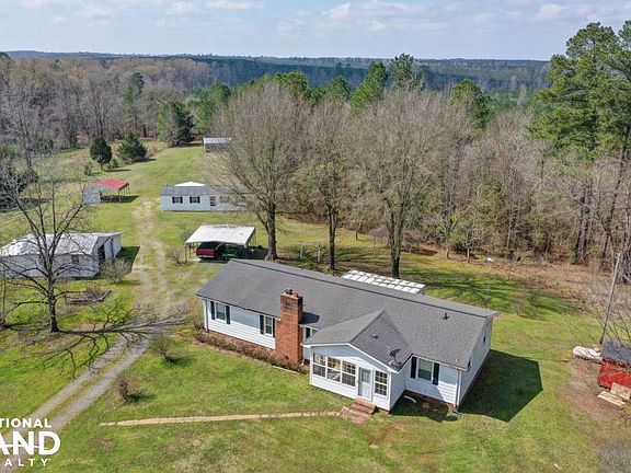 Main Home with Multiple Barnes and Sheds!