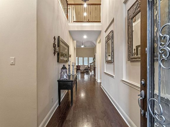 Grand entry with high ceilings and beautiful floors.