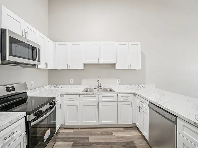 Ample cabinetry and modern finishes_perfect for cooking and entertaining.