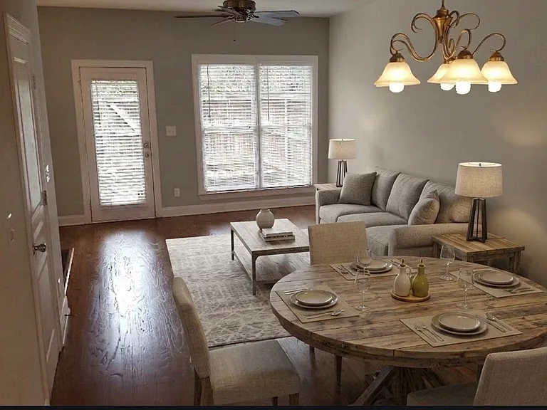 spacious open floor plan with room for dining table and living and entertainment area (virtually staged)