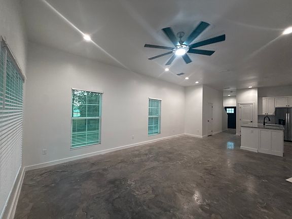 Open floor plan with lots of light! Large living area, breakfast area fully open to the kitchen. End units have these side windows for extra light but TONS of can lights and large ceiling fan. TALL ceilings at 10' give a very spacious feel.