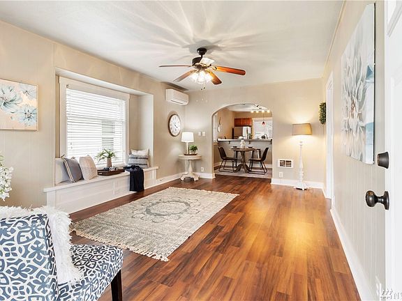Brand new shiny floors and an adorable window alcove included in this spacious room.