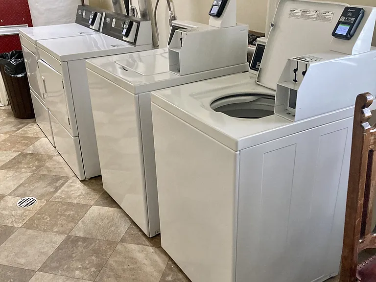 Credit card activated washers and dryers in the building.