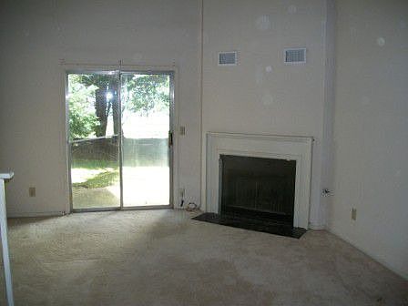Living Room downstairs with 2 story cielings
